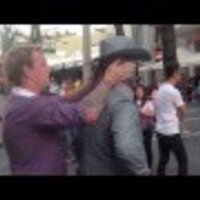 Street Performer Punches Man