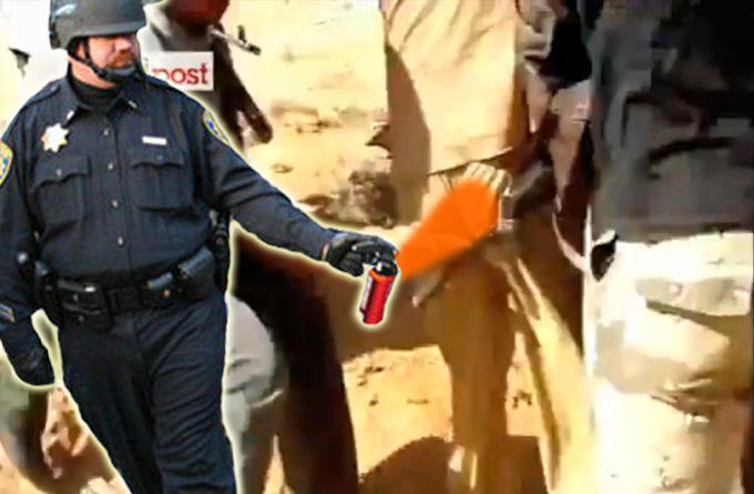 pepper-spray-cop-gadaffi.jpg