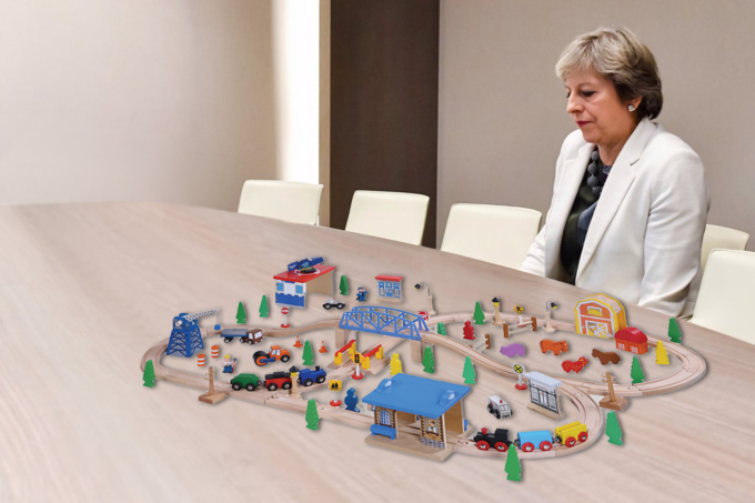 Lonely Theresa May playing with model trains on her table Lonely Theresa May playing with model trains on her table