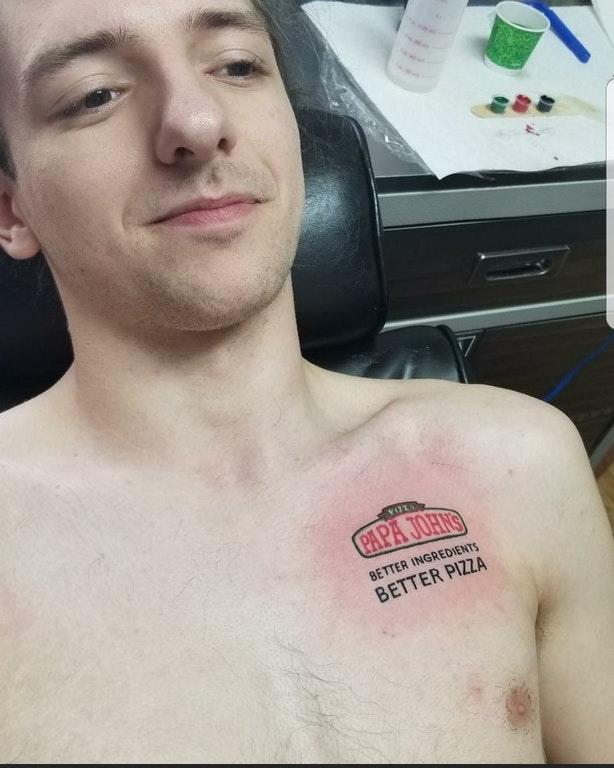 Man with his first tattoo posted on Reddit which was a Papa John's logo on his chest Man with his first tattoo posted on Reddit which was a Papa John's logo on his chest